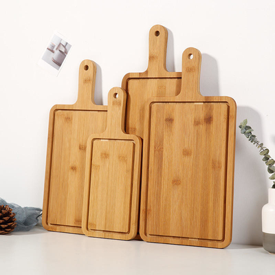 Το ψωμί 4pcs cOem έθεσε στο μεγάλο μπαμπού τον τέμνοντα πίνακα με τη λαβή